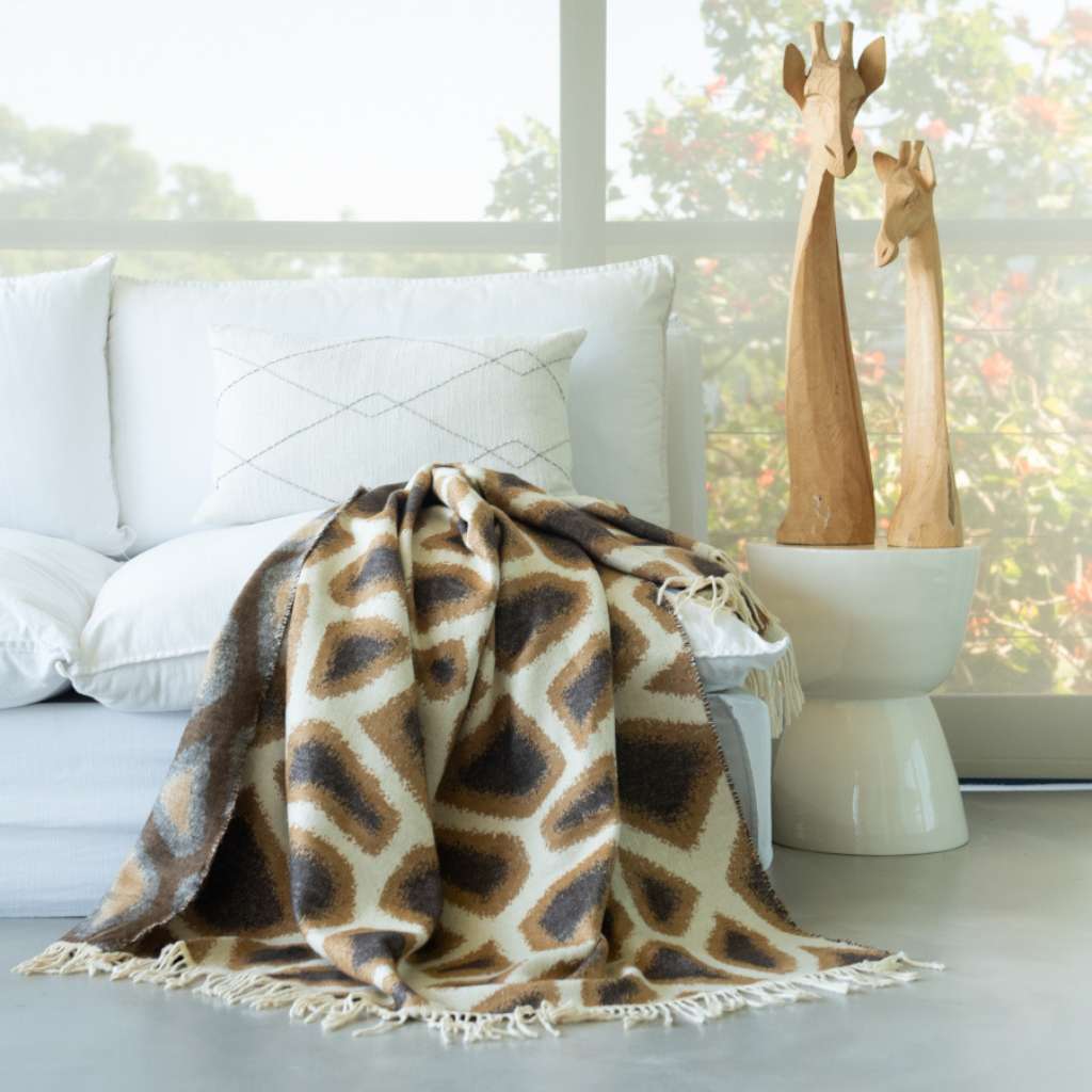 Lifestyle image of the Giraffe Skin Throw Ivory/Leather
