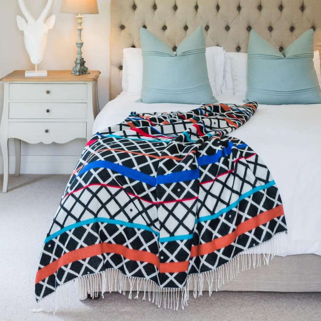 Lifestyle view of the Xhosa Ithumbu Throw Black/Natural 1