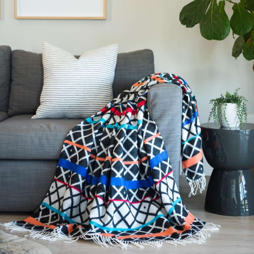 Lifestyle view of the Xhosa Ithumbu Throw Black Natural 2