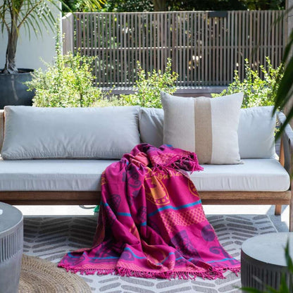 Lifestyle view of the Basotho Throw Cerise/Grape 1