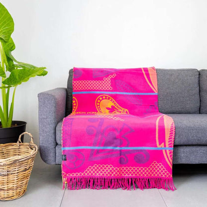 Lifestyle view of the Basotho Throw Cerise/Grape 3
